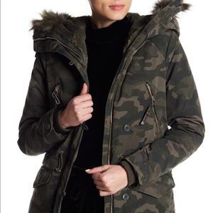 DEX women’s winter jacket in camouflage print.